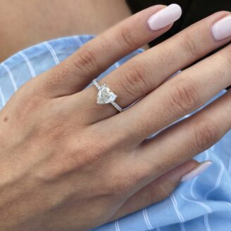 Ava ring - hear shared 1.29 carat engagement ring on a finger