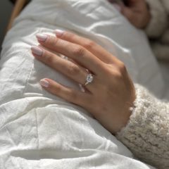 Camila diamond engagement ring worn on a finger
