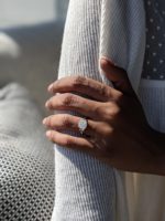 Leslie ring - 2.6 carat cushion cut diamond ring on a finger