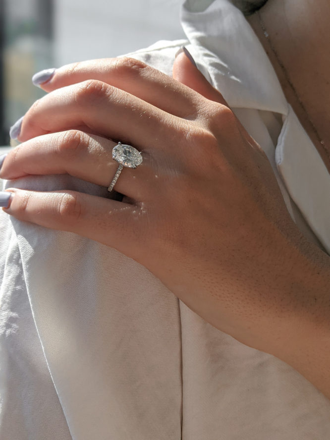 Alexandra diamond ring worn on a finger