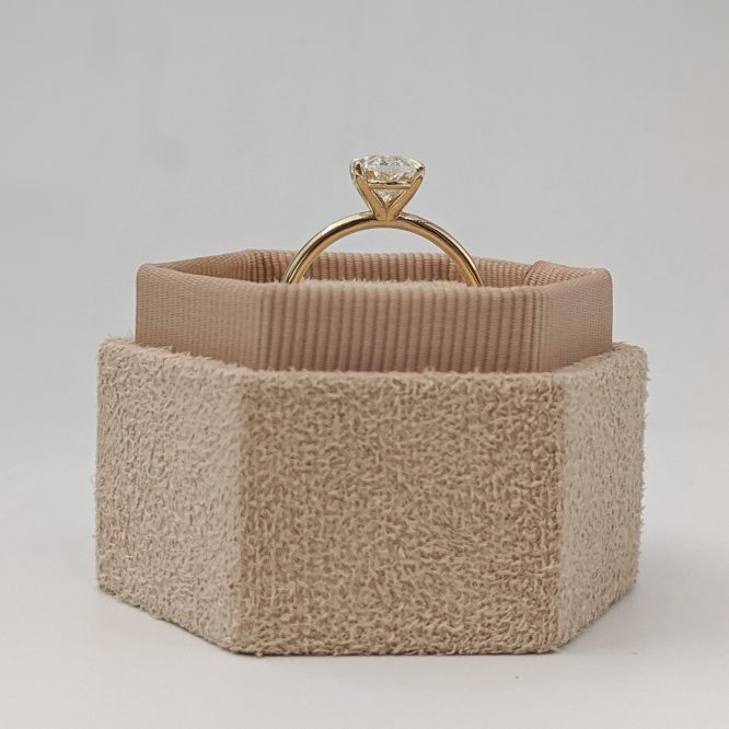 Amelia ring shown in a decorative box from the side