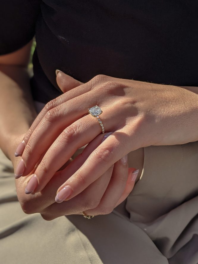 Layla diamond ring worn on a finger