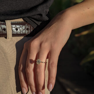 Amelia ring with a big diamond worn on a finger
