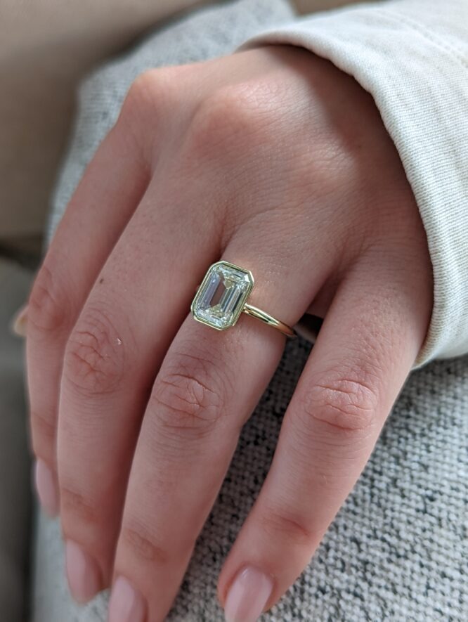 Everly engagement ring worn on a finger