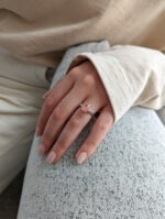 Stella ring worn on a finger