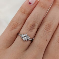 Addison engagement ring on a finger